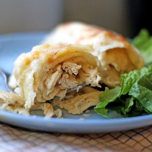 Sour Cream Chicken Enchiladas on a blue plate