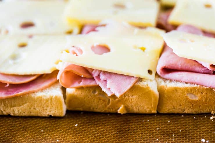Sweet Ham and Swiss Sliders are a perfect party food and can be baked whenever you're ready to eat, so they're always hot and melty for your guests!
