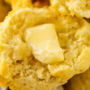 Close up of biscuit with a pat of butter on it