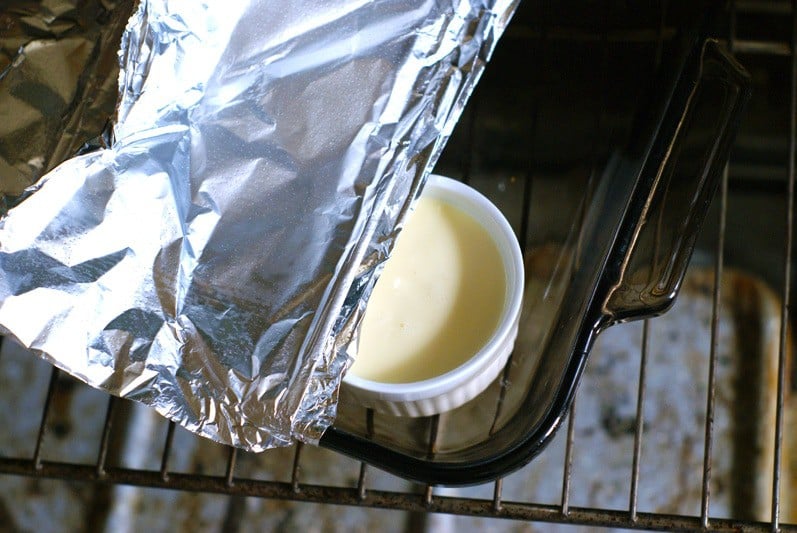 covering filled ramekins with foil