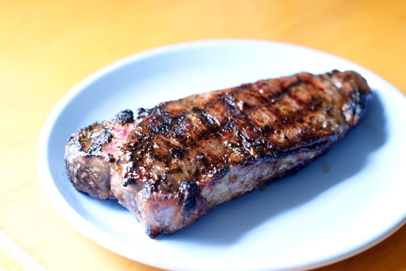 grilled steak on a blue plate