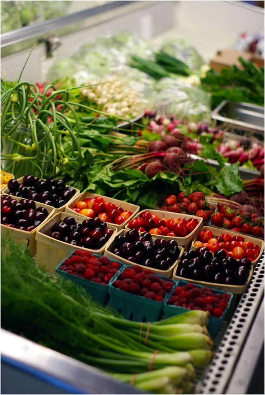 Cherries and other produce in a produce case