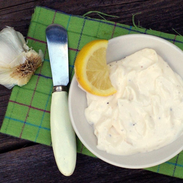lemon garlic aioli in a white bowl on a green napkin