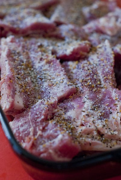 seasoned ribs in a glass baking dish