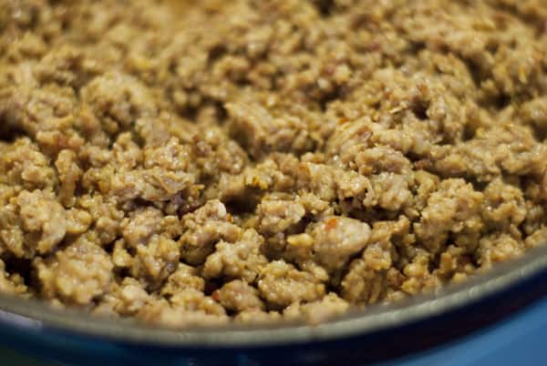 close up of crumbled sausage in a pan 