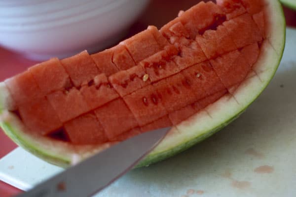 Loosening watermelon slices out of watermelon slice.