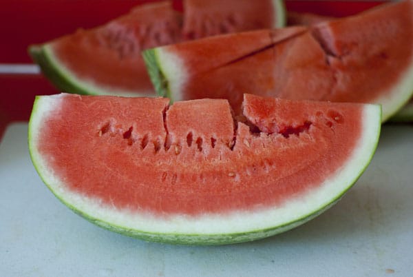 Three slices of fresh watermelon.