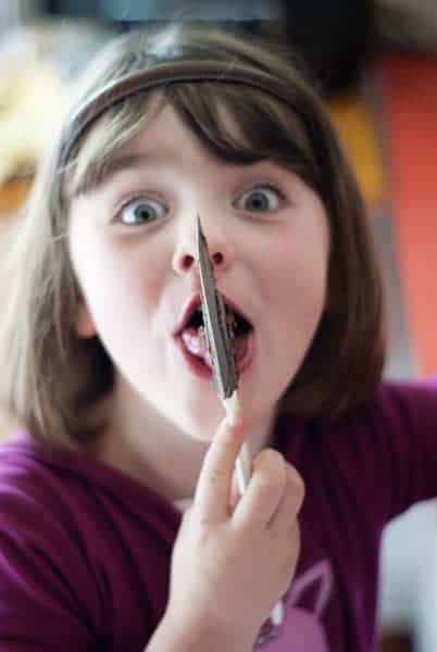 Girl Licking Cake Mix Brownie Batter Spatula