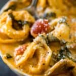 Creamy Slow Cooker Tortellini Soup is a comforting soup that takes just a few minutes prep time, 7 ingredients, and basically makes itself.