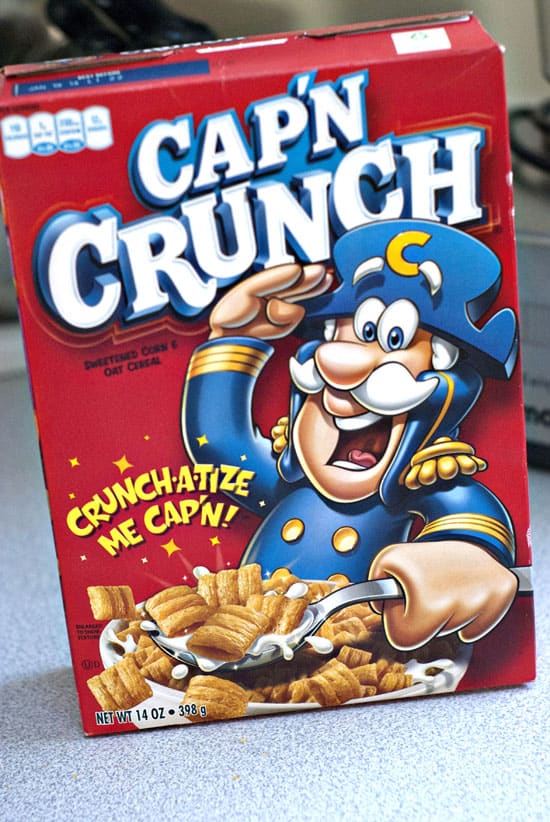 Box of Cap'n Crunch on a table.