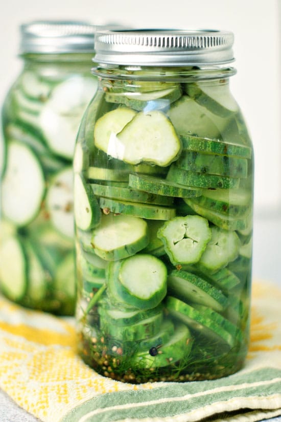 Refrigerator Pickles recipe in two glass mason jars.