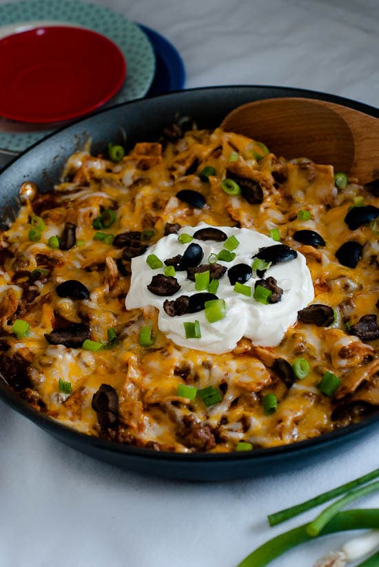 Easy Beef Enchilada Skillet topped with olives and green onions.