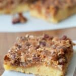 Simple Hornet's Nest Cake with butterscotch and pecans on a wooden table.