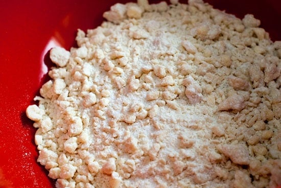 Homemade pie crust ingredients in a large red bowl.