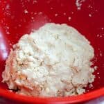 Easy pie crust dough ingredients in a large red bowl.