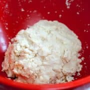 Easy pie crust dough ingredients in a large red bowl.