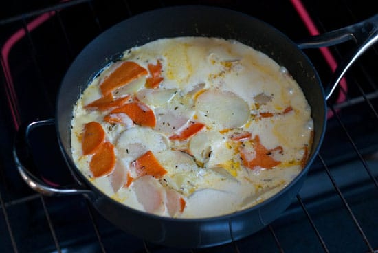 Herbed Sweet Potato Gratin recipe in a large black skillet.