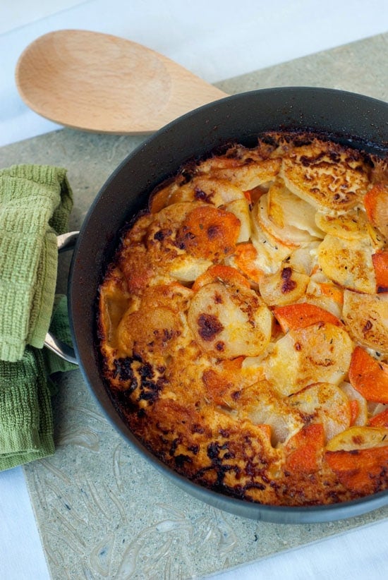 Herbed Sweet Potato Gratin in a black skillet.