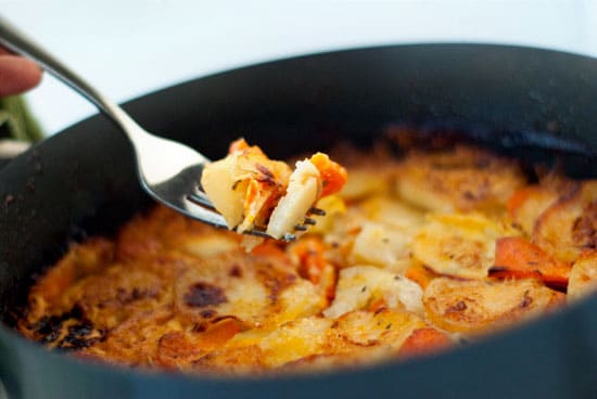 Cripsy Sweet Potato Gratin in a large black skillet.