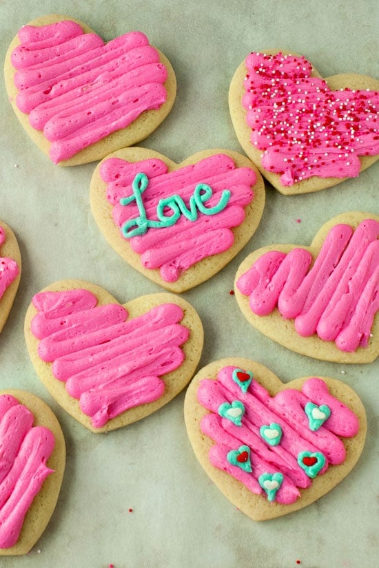 Delicious soft sugar cookies in heart shaped with pink frosting. 