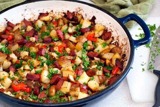 Delicious Potato and Sausage recipe in a blue skillet.