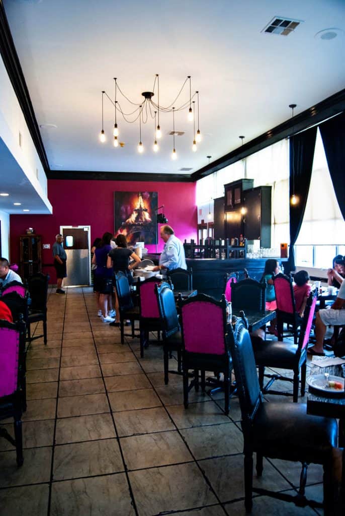 Breakfast room at the Ayres Inn with pink and black chairs.