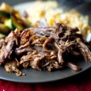 Easy Blackberry BBQ Pulled Pork on a black plate.