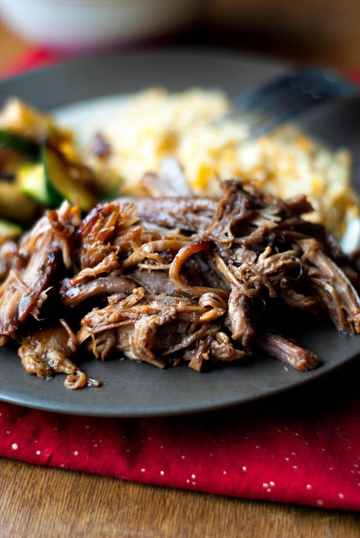 Delicious Blackberry BBQ Pulled Pork on a black plate.