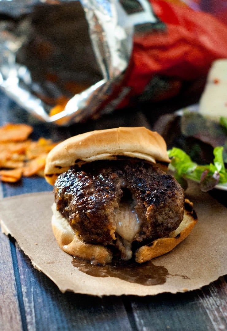 Easy and simple Pepper Jack Stuffed Doritos Burger on a wooden table.