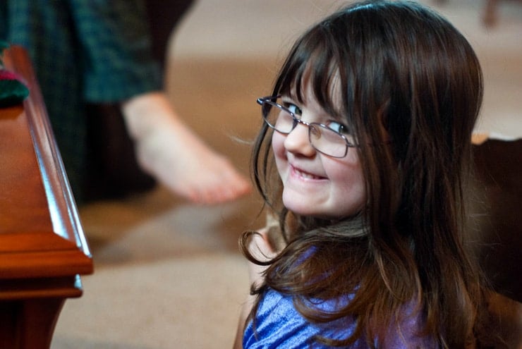 Little girl with glasses.