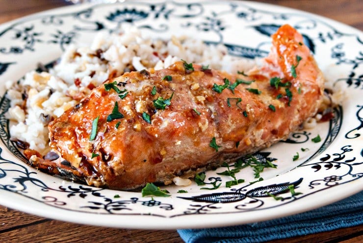 Real Maple Syrup, fresh garlic, and soy sauce make the perfect marinade for this Maple Garlic Baked salmon  It's lightly sweet and caramelizes so well, you'll never eat salmon another way again. ;) 