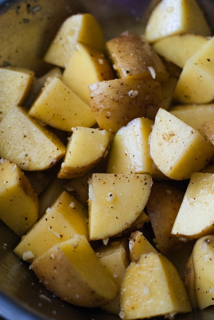 These Super Crispy Oven Roasted Garlic Potatoes are what my dreams are made of. They are made quick and easy in the oven and take just a few minutes to throw together, making them a perfect quick side for dinner!