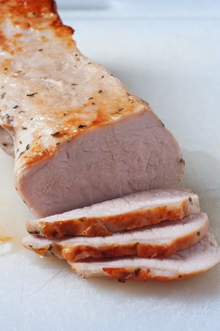 Cooked Pork Tenderloin being sliced