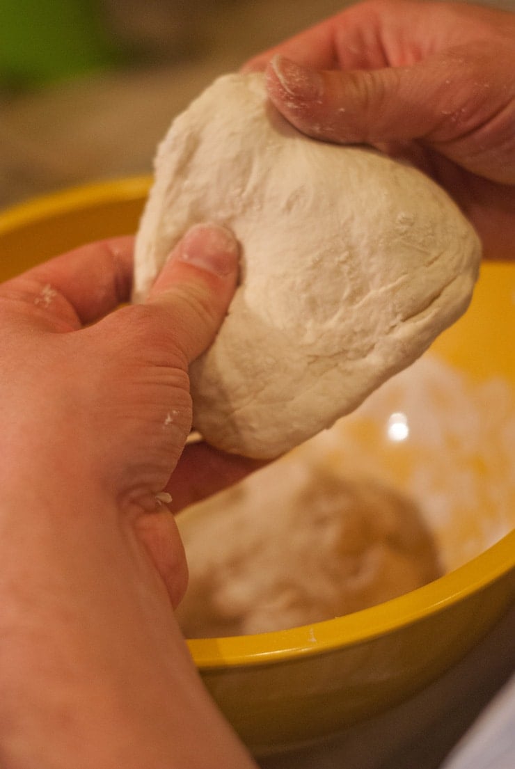 Navajo Tacos dough being stretched into a disk