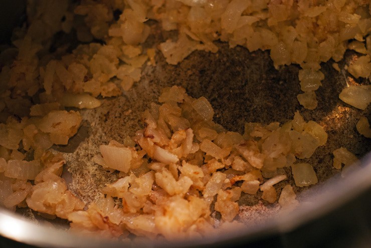 Onions and flour cooking in a pot