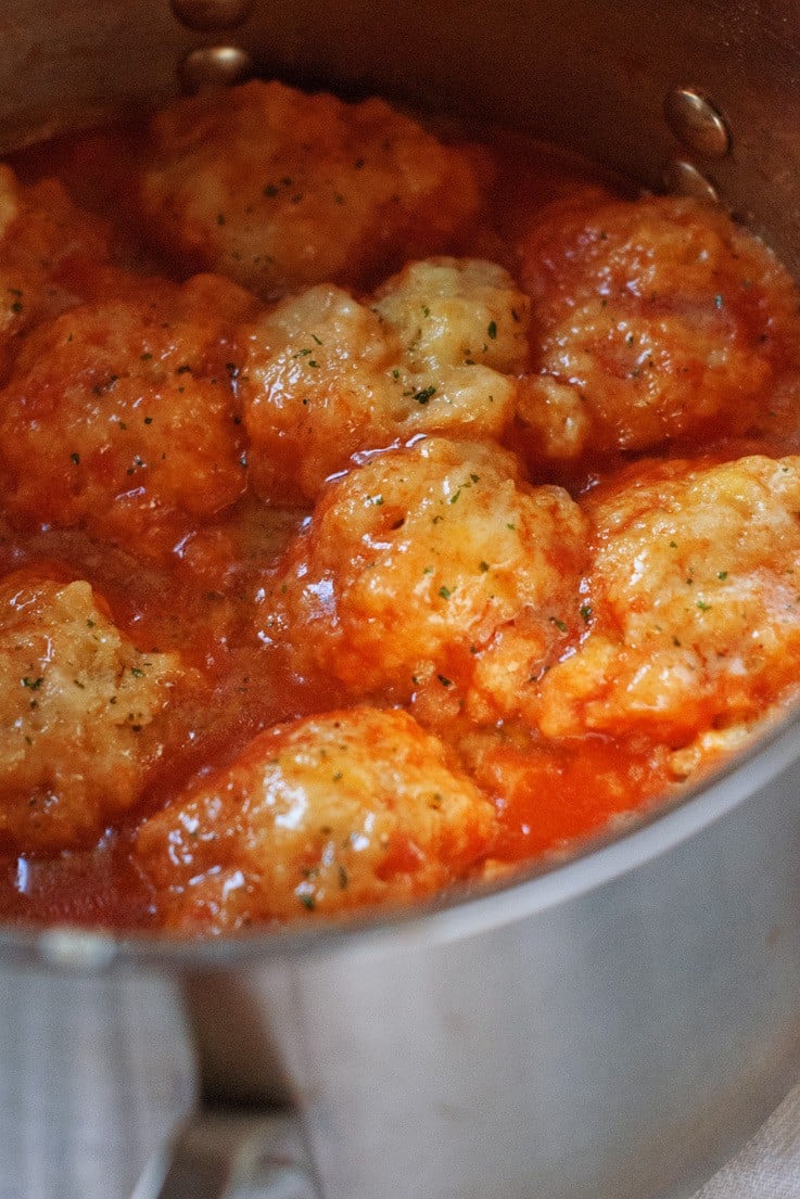 Close up of Creamy Tomato Soup with Cheddar Bay Dumplings