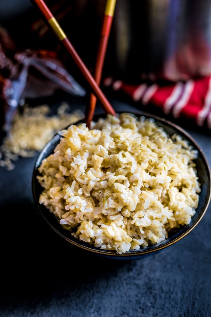 Bowl of fluffy perfect brown rice with chopsticks