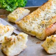 The Best Cheesy Garlic Bread! You might shirk at one of the ingredients, but believe me, you're going to want to try this one! Buttery, tangy, garlicky, and so, so cheesy. THE BEST!