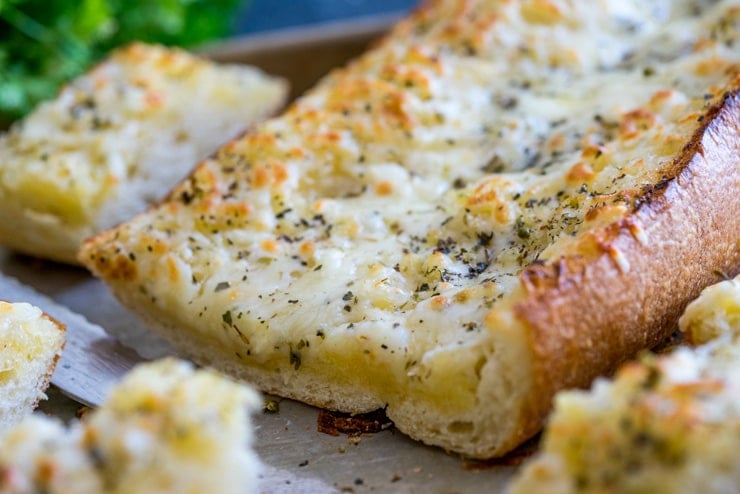 The Best Cheesy Garlic Bread! You might shirk at one of the ingredients, but believe me, you're going to want to try this one! Buttery, tangy, garlicky, and so, so cheesy. THE BEST! 
