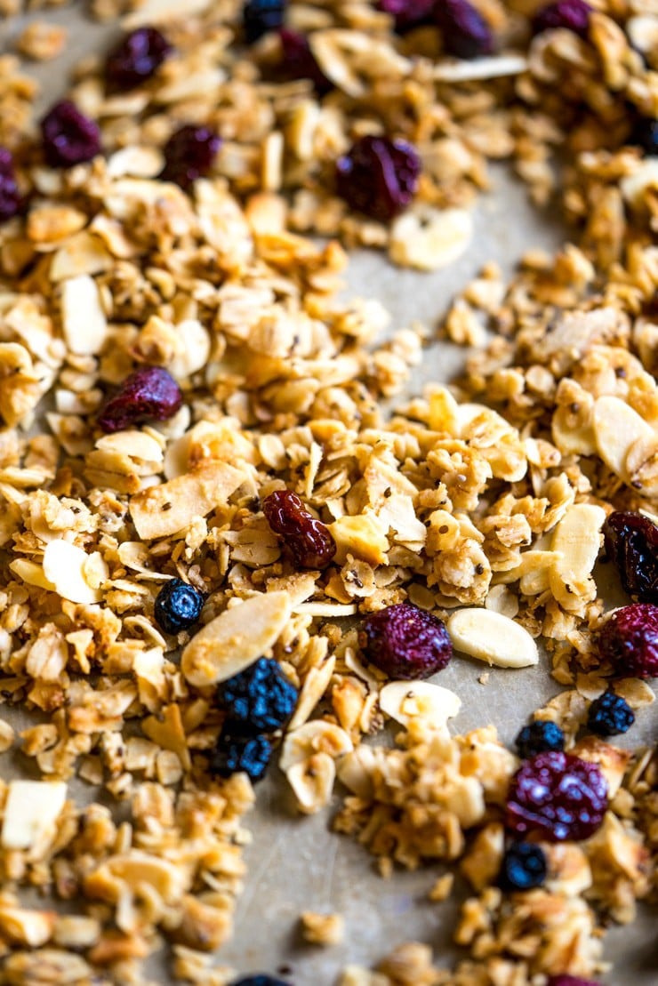 This sweet, salty, crunchy, and chewy coconut oil granola is the perfect breakfast to keep you going strong through the holidays. It's filled with big flakes of unsweetened coconut flakes, oats, whole wheat flour, chia seeds, almonds and studded with sweet dried berries. #GracelandHoliday AD