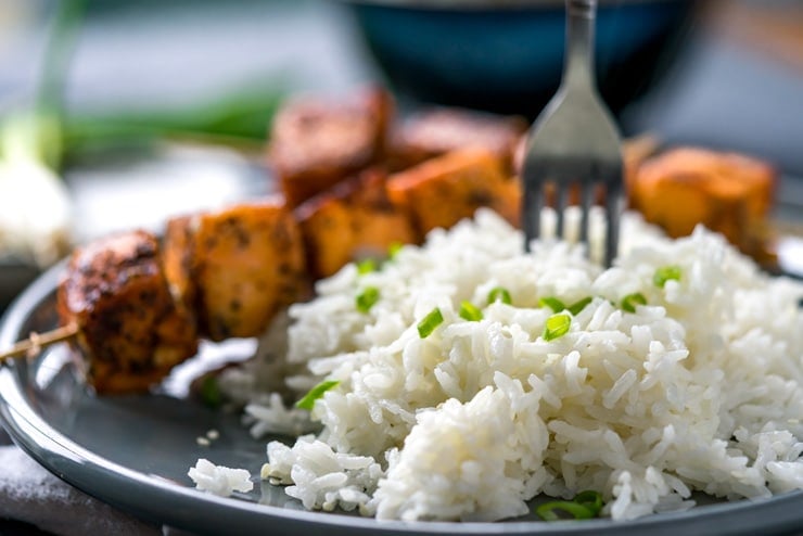 You're going to love these spicy and Sweet Sriracha Rubbed Salmon Skewers, especially paired with some crazy good fragrant coconut rice. It's a meal that is done in well under 30 minutes but delivers some seriously big flavor.