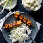 You're going to love these spicy and Sweet Sriracha Rubbed Salmon Skewers, especially paired with some crazy good fragrant coconut rice. It's a meal that is done in well under 30 minutes but delivers some seriously big flavor.