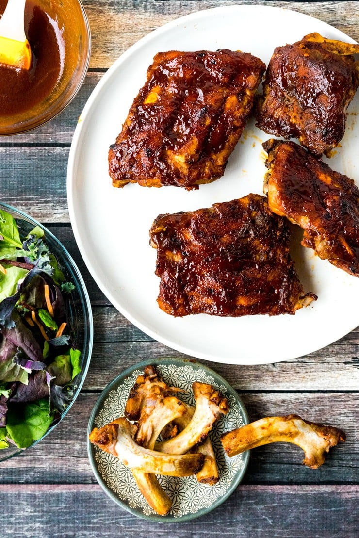 Instant Pot BBQ Babyback Ribs with sauce on a white plate