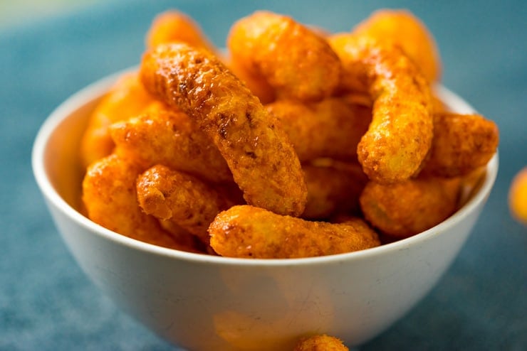 Candied Caramel Cheetos in a white bowl. 