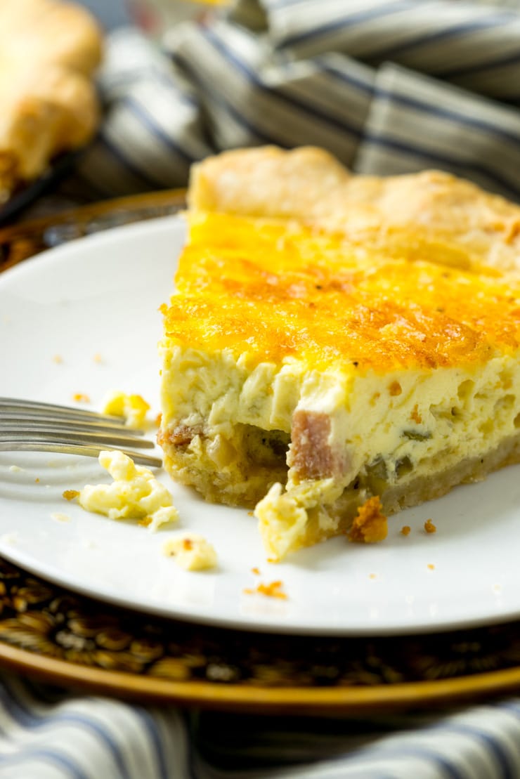 Best basic quiche recipe slice on white plate