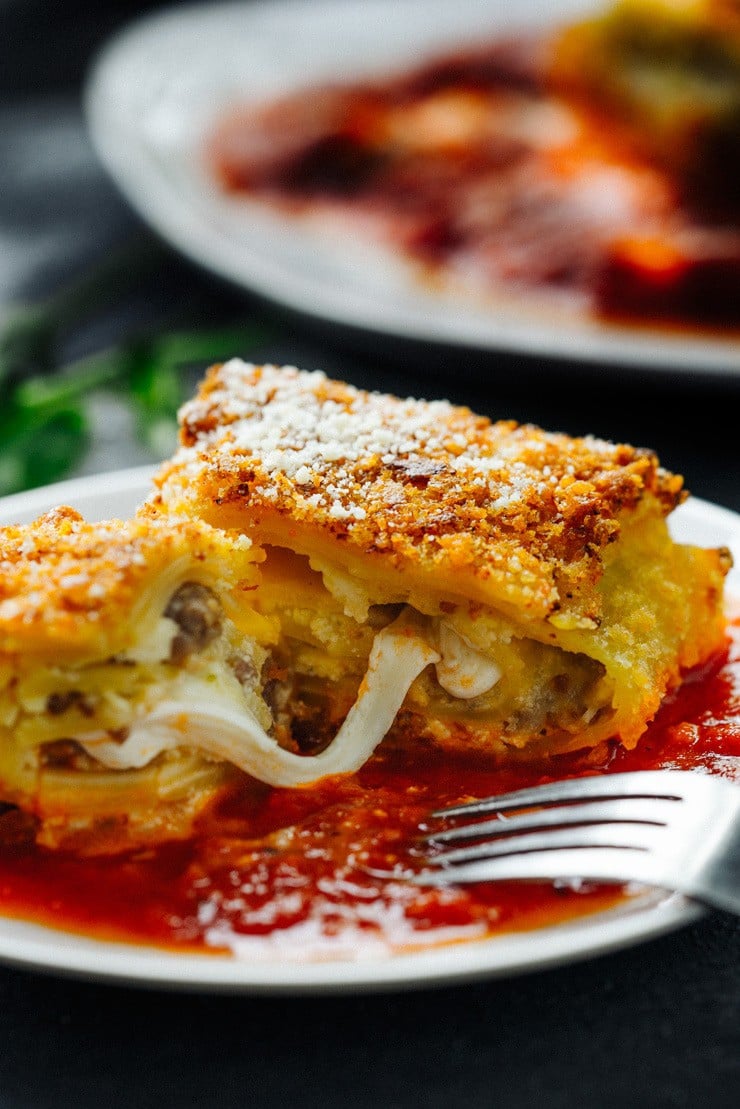 Lasagna bomb cut in half on white plate