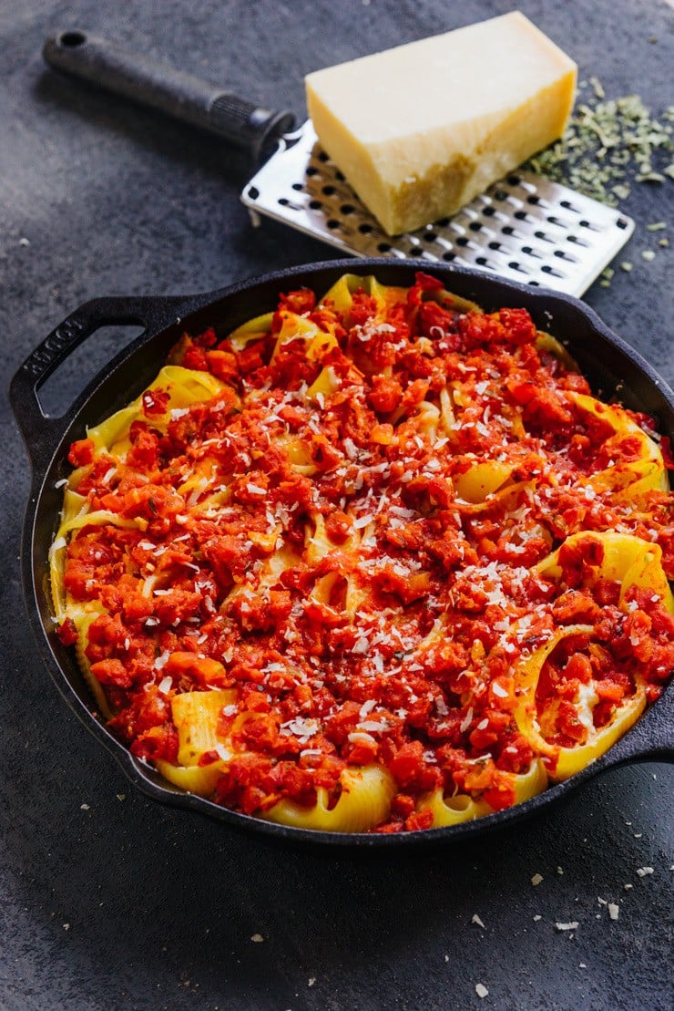 five cheese stuffed lumaconi in a cast iron skillet