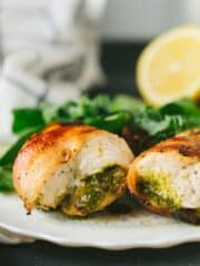 The easiest, moistest, most flavorful chicken ever! This bacon wrapped pesto chicken is packed with flavor and takes only 15 minutes to bake under the broiler. making it a perfect weeknight meal!