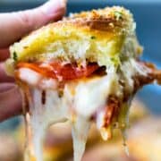 These 4 "Out of The Box" easy pizza recipes are perfect for #gameday #entertaining or the upcoming #holidays. Each easy pizza recipe only takes a handful of ingredients, too! #easypizza #pizzarecipe #pizza #mozzarella #pepperoni #easydinner #sliders #tatertots #breadsticks
