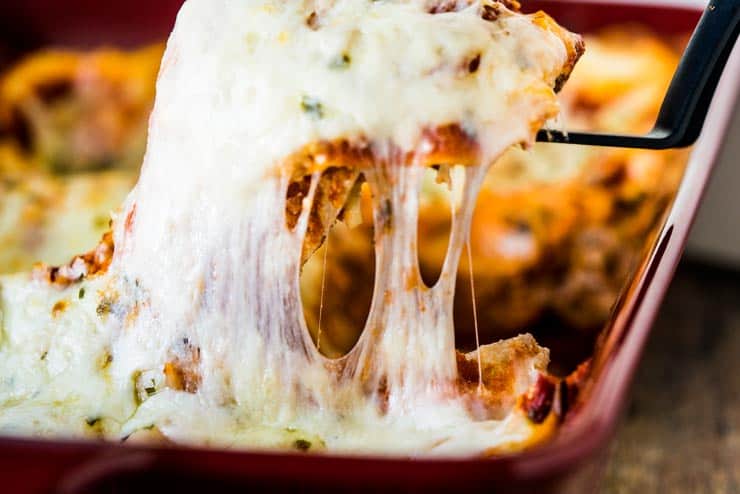 A piece of meatless lasagna being pulled out of a the pan